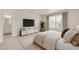 Spacious main bedroom with ensuite bathroom and large window at 2262 Base St, Fort Lupton, CO 80621