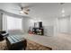Expansive bonus room featuring neutral walls, plush carpet, and bright natural light at 18189 House Finch Ln, Parker, CO 80134