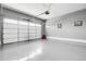 Spacious two car garage featuring a sealed concrete floor and an insulated garage door at 18189 House Finch Ln, Parker, CO 80134