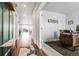 Inviting hallway leading to a bright office space with stylish decor and wood desk at 18189 House Finch Ln, Parker, CO 80134