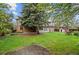 Wide backyard displaying a well-maintained lawn, mature trees, and an inviting outdoor area perfect for Gathering gatherings at 930 S Dayton St, Denver, CO 80247