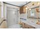 Bathroom featuring a shower and vanity at 930 S Dayton St, Denver, CO 80247