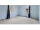 Bedroom with natural light and plush carpeting provides a peaceful retreat at 930 S Dayton St, Denver, CO 80247