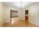 Dining room with chandelier and hardwood floors at 930 S Dayton St, Denver, CO 80247