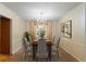 Elegant dining room with chandelier and large window, perfect for gatherings at 930 S Dayton St, Denver, CO 80247