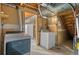 Basement laundry room with washer, dryer and access to utilities is ready for use at 930 S Dayton St, Denver, CO 80247