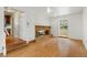 Cozy living room featuring a brick fireplace at 930 S Dayton St, Denver, CO 80247
