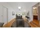 Bright living room with skylight, hardwood floors, and a partial view of the bathroom at 930 S Dayton St, Denver, CO 80247