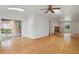 Large living room with access to backyard, with hardwood floors and natural light at 930 S Dayton St, Denver, CO 80247
