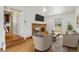 Inviting living room with fireplace and hardwood floors, steps leading to another room at 930 S Dayton St, Denver, CO 80247