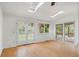 Sunlit living room with skylights and doors to outside at 930 S Dayton St, Denver, CO 80247