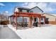 Spacious backyard with pergola and patio area at 580 Mount Massive St, Berthoud, CO 80513