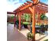 Relaxing backyard patio with pergola, table, chairs, and grill at 580 Mount Massive St, Berthoud, CO 80513