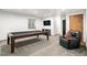 Finished basement with pool table and seating at 580 Mount Massive St, Berthoud, CO 80513