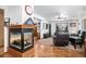 Corner fireplace with a modern design and a view of the living room at 580 Mount Massive St, Berthoud, CO 80513