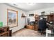 Bright home office with built-in desk and window at 580 Mount Massive St, Berthoud, CO 80513
