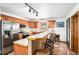 Modern kitchen with stainless steel appliances and an island with seating at 580 Mount Massive St, Berthoud, CO 80513
