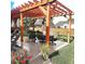 Relaxing patio with pergola, seating, and grill at 580 Mount Massive St, Berthoud, CO 80513