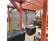 Covered patio with a wooden pergola and gray shade screens at 580 Mount Massive St, Berthoud, CO 80513