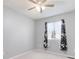 Bright bedroom with window, floral curtains and ceiling fan at 21631 E Crestridge Pl, Centennial, CO 80015