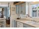 Kitchen with blue cabinets, light countertops, and stainless steel appliances at 445 4Th St, Bennett, CO 80102