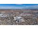 Aerial view of a residential neighborhood with city skyline in the distance at 4653 S Lowell Blvd # B, Denver, CO 80236