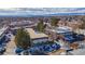 Aerial view of a multi-unit building with ample parking and mountain views at 4653 S Lowell Blvd # B, Denver, CO 80236