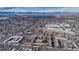 Aerial view showing a residential area with mountain views and a lake at 4653 S Lowell Blvd # B, Denver, CO 80236