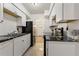 Updated kitchen boasts granite countertops and white cabinetry at 4653 S Lowell Blvd # B, Denver, CO 80236