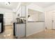 Modern kitchen with granite countertops and white cabinets at 4653 S Lowell Blvd # B, Denver, CO 80236