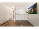 Living room with hardwood floors and kitchen pass through at 4653 S Lowell Blvd # B, Denver, CO 80236