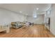 Spacious basement with laminate flooring, white paneled walls, recessed lighting, and ample living space at 3854 Perry St, Denver, CO 80212
