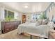 Bright bedroom with many windows, cozy carpet, and great decor at 3854 Perry St, Denver, CO 80212