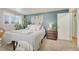 Inviting bedroom featuring an accent wall, soft carpet, and natural light at 3854 Perry St, Denver, CO 80212