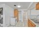 Kitchen featuring a laundry area with full size washer and dryer at 3854 Perry St, Denver, CO 80212