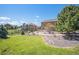 Lush backyard offers a serene retreat with mature trees and tasteful landscaping at 1822 Painter Dr, Monument, CO 80132