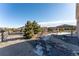 Backyard with a wooden gazebo and desert style landscaping and wooden fence at 1822 Painter Dr, Monument, CO 80132