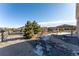 Spacious backyard with gravel landscaping, a gazebo, and mature trees at 1822 Painter Dr, Monument, CO 80132
