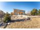 Home's backyard featuring a gazebo and a fire pit area at 1822 Painter Dr, Monument, CO 80132