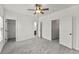 Bright, spacious bedroom with ceiling fan and multiple doorways at 1822 Painter Dr, Monument, CO 80132