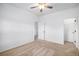 Bright bedroom with neutral carpet, ceiling fan, and convenient closet access at 1822 Painter Dr, Monument, CO 80132