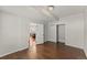 Bedroom with hardwood floors, sliding closet doors, and view of the dining room at 1822 Painter Dr, Monument, CO 80132