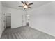 Spacious bedroom with soft grey carpet and a ceiling fan for comfort at 1822 Painter Dr, Monument, CO 80132