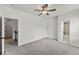 Bright bedroom with neutral carpet and easy access to the en-suite bathroom at 1822 Painter Dr, Monument, CO 80132