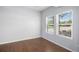 Well-lit bedroom featuring sleek wood floors, neutral paint and an abundance of natural light at 1822 Painter Dr, Monument, CO 80132