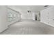 Spacious bonus room with multiple windows, soft carpet, and ceiling fan at 1822 Painter Dr, Monument, CO 80132