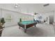 Bright bonus room featuring a pool table with seating area, and natural light at 1822 Painter Dr, Monument, CO 80132