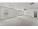 Large bonus room with lots of natural light, neutral carpet and ceiling fan at 1822 Painter Dr, Monument, CO 80132