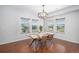 Inviting dining room features hardwood floors, natural light, and a stylish chandelier at 1822 Painter Dr, Monument, CO 80132