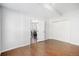 Bright, freshly painted room showcases hardwood floors, closet space and leads to the dining room at 1822 Painter Dr, Monument, CO 80132